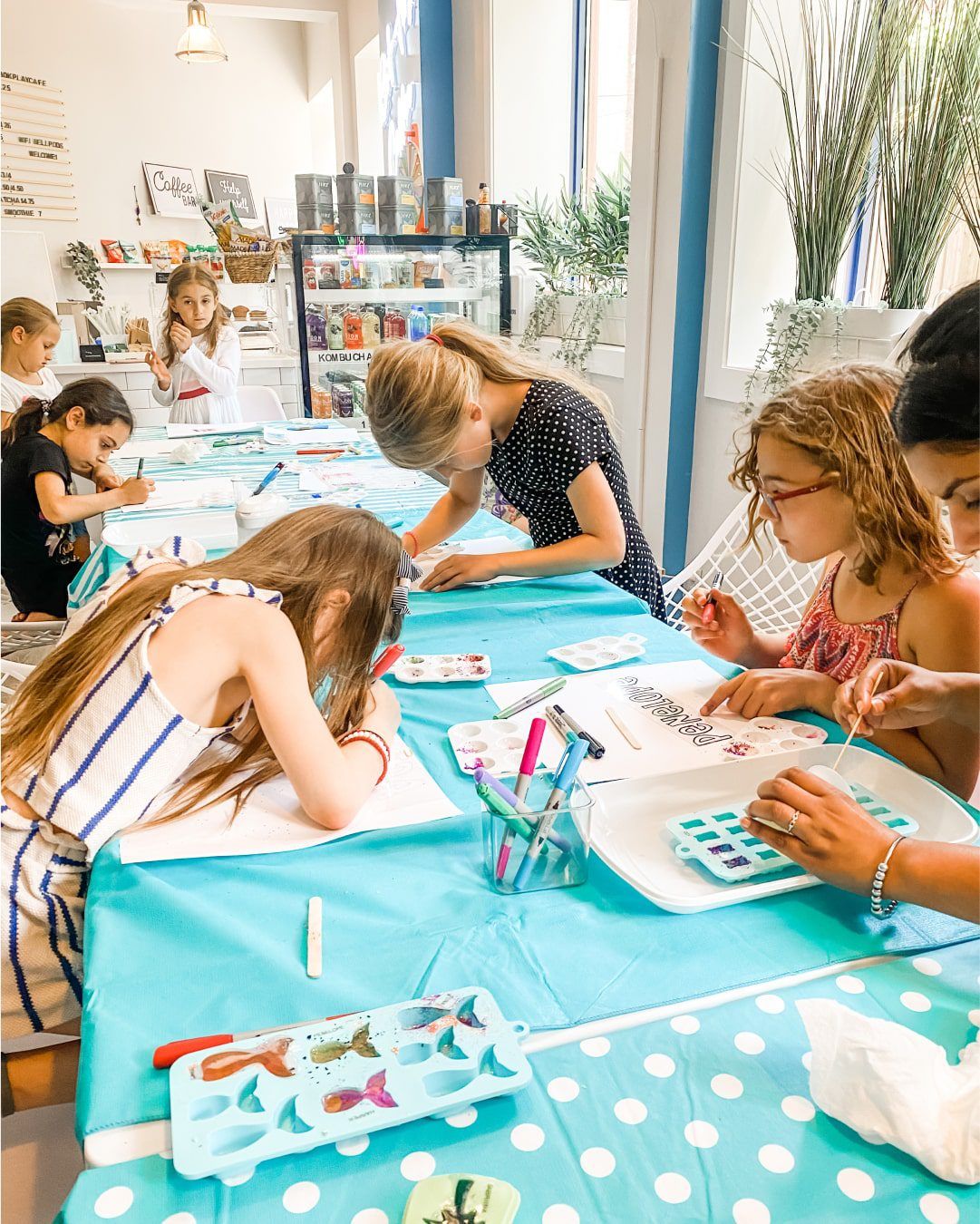 Creative activities for kids: Children engaged in arts and crafts, creating their own masterpieces during a private event.