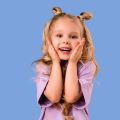 Party Entertainment for Children: Kids and parents laughing and playing with a ball pit and wooden play structures.